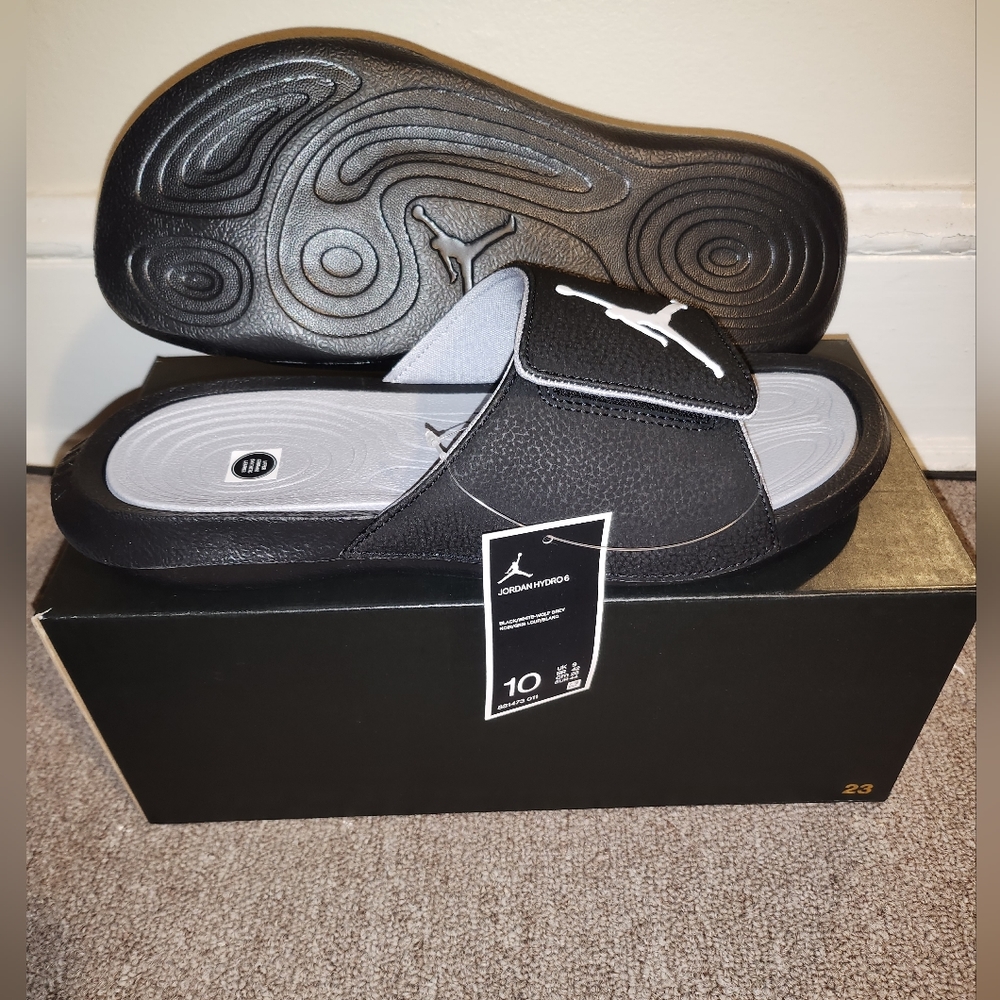 Jordan Slids size 10 black and white also Gray and white size 9's ask about